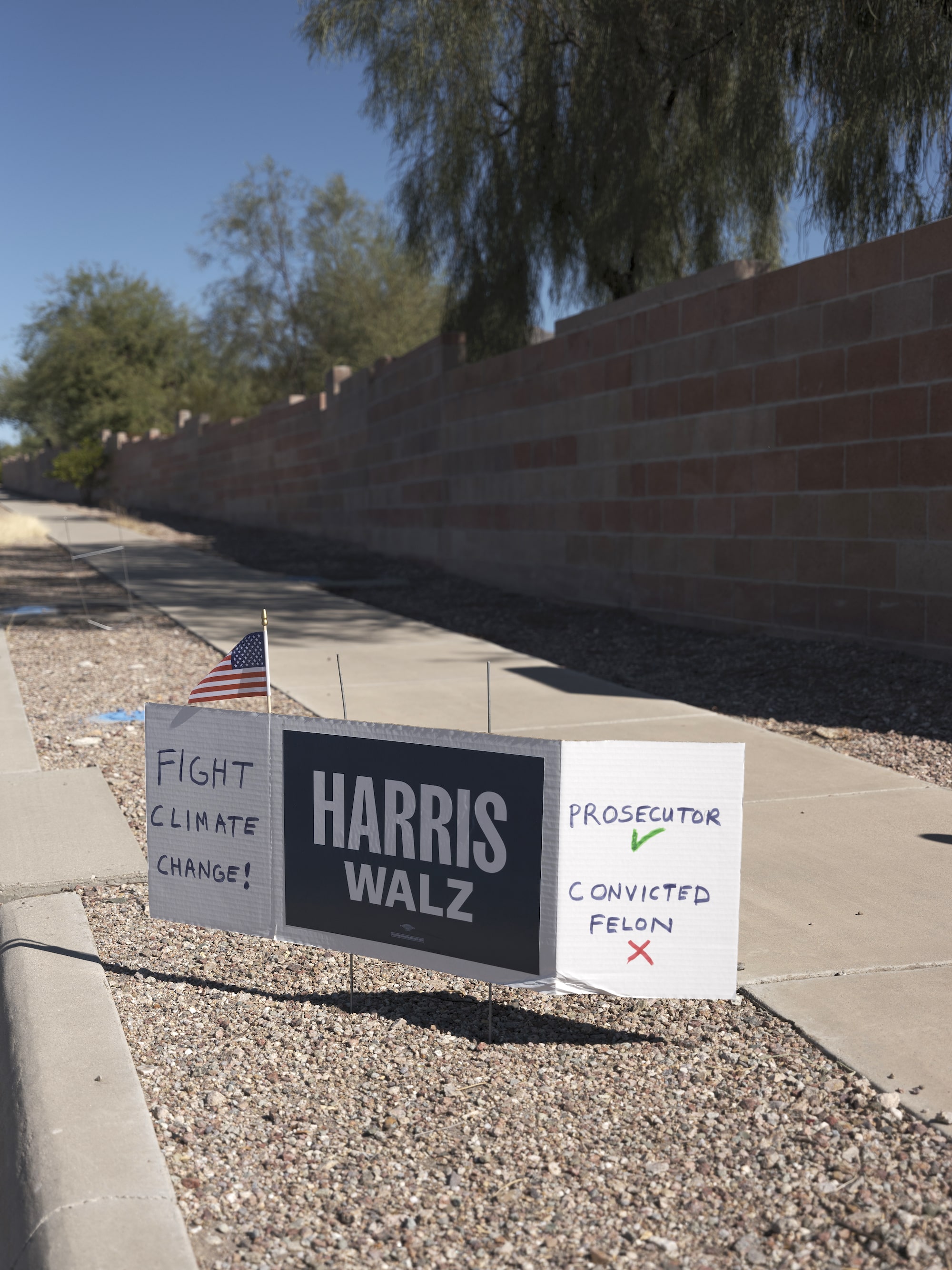 A political sign with Kamala Harris and a callout to care about climate change